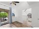 Bedroom featuring vaulted ceilings, a ceiling fan, wood-look floors, and sliding glass doors to a balcony at 8844 S 51St St # 3, Phoenix, AZ 85044