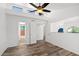 Bright bedroom features high ceilings, a ceiling fan, and light wood-look floors at 8844 S 51St St # 3, Phoenix, AZ 85044