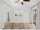 Bedroom featuring vaulted ceilings, a ceiling fan, wood-look floors, and sliding glass doors to a balcony at 8844 S 51St St # 3, Phoenix, AZ 85044