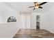 Bedroom featuring vaulted ceilings, a ceiling fan, wood-look floors, and sliding glass doors to a balcony at 8844 S 51St St # 3, Phoenix, AZ 85044
