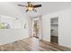 Bedroom featuring vaulted ceilings, a ceiling fan, wood-look floors, and sliding glass doors to a balcony at 8844 S 51St St # 3, Phoenix, AZ 85044