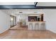 Open-concept dining area featuring a view of the kitchen, a dining table, and bar seating at 8844 S 51St St # 3, Phoenix, AZ 85044