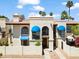 Beautiful two-story condo with blue awnings and a well-maintained stucco exterior under a sunny sky at 8844 S 51St St # 3, Phoenix, AZ 85044