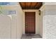 Inviting front door with textured stucco facade and charming welcome mat at 8844 S 51St St # 3, Phoenix, AZ 85044