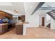 Modern kitchen and dining area featuring stainless steel appliances, wooden cabinets, and tiled countertops at 8844 S 51St St # 3, Phoenix, AZ 85044