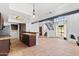 Bright, open living room with a fireplace, tile floors, beam and staircase at 8844 S 51St St # 3, Phoenix, AZ 85044