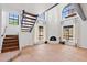 Spacious living room with tile floors, fireplace, wooden beam, and ample natural light from large windows at 8844 S 51St St # 3, Phoenix, AZ 85044