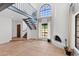 Bright and airy living room featuring a grand fireplace, staircase, and tile flooring at 8844 S 51St St # 3, Phoenix, AZ 85044