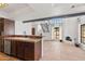 Bright open-concept living room and kitchen, featuring a fireplace, tile floors, beam, staircase at 8844 S 51St St # 3, Phoenix, AZ 85044