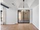 Well-lit patio area featuring a sliding glass door, tile flooring, and neutral wall paint at 8844 S 51St St # 3, Phoenix, AZ 85044