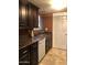 Updated kitchen featuring granite countertops, dark cabinetry, and modern appliances at 913 E Beryl Ave, Phoenix, AZ 85020