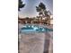 Community pool area featuring a clean pool, lounge chairs, tables, and shaded seating under a covered pavilion at 913 E Beryl Ave, Phoenix, AZ 85020