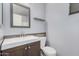 Modern bathroom with a stylish vanity, mirror and a convenient toilet at 924 E Baylor Ln, Gilbert, AZ 85296