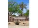 Lindsay Ranch entrance sign with decorative flowers, plants, stone columns, and desert landscaping at 924 E Baylor Ln, Gilbert, AZ 85296