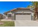 Charming one-story home with a two-car garage, arched entryway, and desert landscaping at 924 E Baylor Ln, Gilbert, AZ 85296