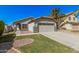 Charming single-Gathering home with a well-maintained lawn, concrete driveway, and two-car garage at 924 E Baylor Ln, Gilbert, AZ 85296