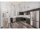 Modern kitchen featuring stainless steel appliances, dark cabinets, and plenty of counter space at 924 E Baylor Ln, Gilbert, AZ 85296