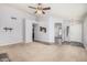 Spacious living room with plush carpet, multiple doorways, and ample natural light at 924 E Baylor Ln, Gilbert, AZ 85296