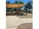 Community playground featuring colorful play structures, benches, shade structures, and a picnic area at 924 E Baylor Ln, Gilbert, AZ 85296