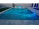 Sparkling in-ground pool with water feature and stone trim, perfect for summer fun at 924 E Baylor Ln, Gilbert, AZ 85296