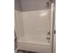 Clean, all-white shower and tub combination is ready for your comfort and convenience at 924 E Baylor Ln, Gilbert, AZ 85296