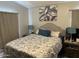 Comfortable bedroom with a queen bed, side tables and neutral decor at 9302 E Broadway Rd # 49, Mesa, AZ 85208