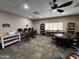 Community room with computers, tables, chairs, and bookshelves at 9302 E Broadway Rd # 49, Mesa, AZ 85208