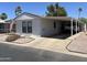 Charming single-story home features a carport and low-maintenance desert landscaping at 9302 E Broadway Rd # 49, Mesa, AZ 85208
