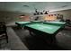 Community game room with four pool tables at 9302 E Broadway Rd # 49, Mesa, AZ 85208