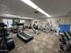 Community gym with carpet, weights, treadmills, stationary bikes, and weight machines at 9302 E Broadway Rd # 49, Mesa, AZ 85208