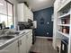 Bright kitchen with white cabinets, black appliances, and gray countertops at 9302 E Broadway Rd # 49, Mesa, AZ 85208