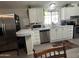 Well-equipped kitchen with stainless steel appliances and bright white cabinetry at 9302 E Broadway Rd # 49, Mesa, AZ 85208