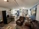 Spacious living area opens to the modern kitchen with stainless steel appliances at 9302 E Broadway Rd # 49, Mesa, AZ 85208
