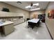 A meeting room with a large table, chairs, and cabinets at 9302 E Broadway Rd # 49, Mesa, AZ 85208
