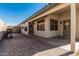 Enjoy the outdoors with this covered patio and stone pavers, perfect for entertaining and relaxation at 9438 E Plana Ave, Mesa, AZ 85212