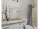 Bathroom featuring gray walls, granite counters and a bathtub and shower combo at 9438 E Plana Ave, Mesa, AZ 85212