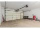 Bright and spacious garage with an automatic door at 9438 E Plana Ave, Mesa, AZ 85212