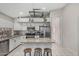 The spacious kitchen includes stainless appliances, granite countertops, and ample workspace on the center island at 9438 E Plana Ave, Mesa, AZ 85212
