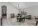 Open-concept living room with tile floors and vaulted ceilings at 9438 E Plana Ave, Mesa, AZ 85212