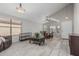Bright living room with tile floors, modern lighting, and dining room combination at 9438 E Plana Ave, Mesa, AZ 85212