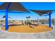 Fun playground area with shade structures, play equipment, and seating, perfect for Gathering enjoyment at 10211 W Columbus Ave, Avondale, AZ 85392