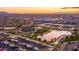 Aerial view of a community event by a lake with food trucks at sunset at 10539 E Corbin Ave, Mesa, AZ 85212