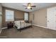 Comfortable bedroom with carpeted floors and shutters that offer privacy and natural light at 10539 E Corbin Ave, Mesa, AZ 85212