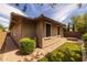 Exterior view of the home featuring a brick paver walkway and a grassy area at 10539 E Corbin Ave, Mesa, AZ 85212