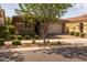 Charming single-story home featuring a two-car garage, brick driveway, and well-manicured landscaping at 10539 E Corbin Ave, Mesa, AZ 85212