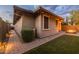 Home exterior featuring a brick paver walkway and a small grassy area at 10539 E Corbin Ave, Mesa, AZ 85212