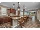 Modern kitchen with granite counters, stainless appliances, and breakfast bar seating at 10539 E Corbin Ave, Mesa, AZ 85212