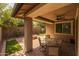 Covered patio featuring outdoor seating and a view of the landscaped backyard at 10539 E Corbin Ave, Mesa, AZ 85212