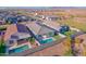 Drone shot showcasing homes with pools and landscaped yards in a residential neighborhood at 11357 E Unger Ave, Mesa, AZ 85212