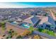Drone shot of several homes in a community, some with pools and well-kept yards at 11357 E Unger Ave, Mesa, AZ 85212